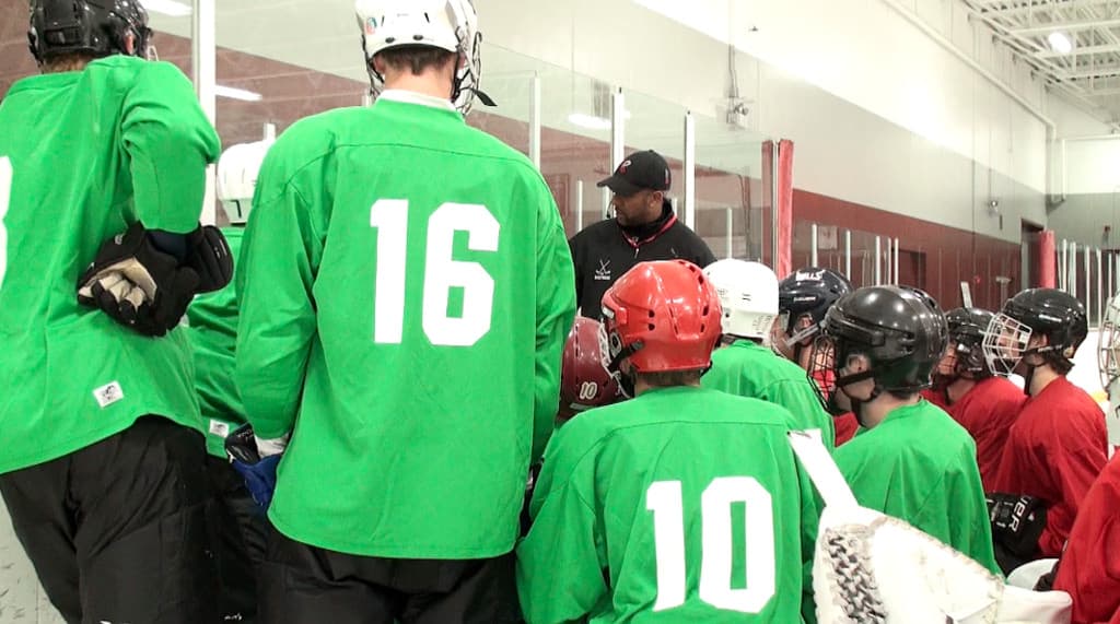 Hockey team listening to their coach